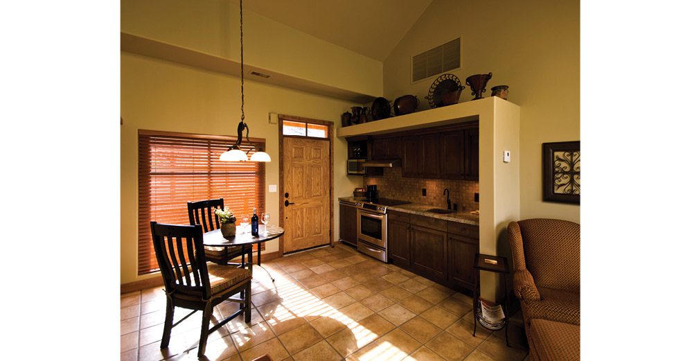 Kitchen and dining area in the Executive Suite at The Villa