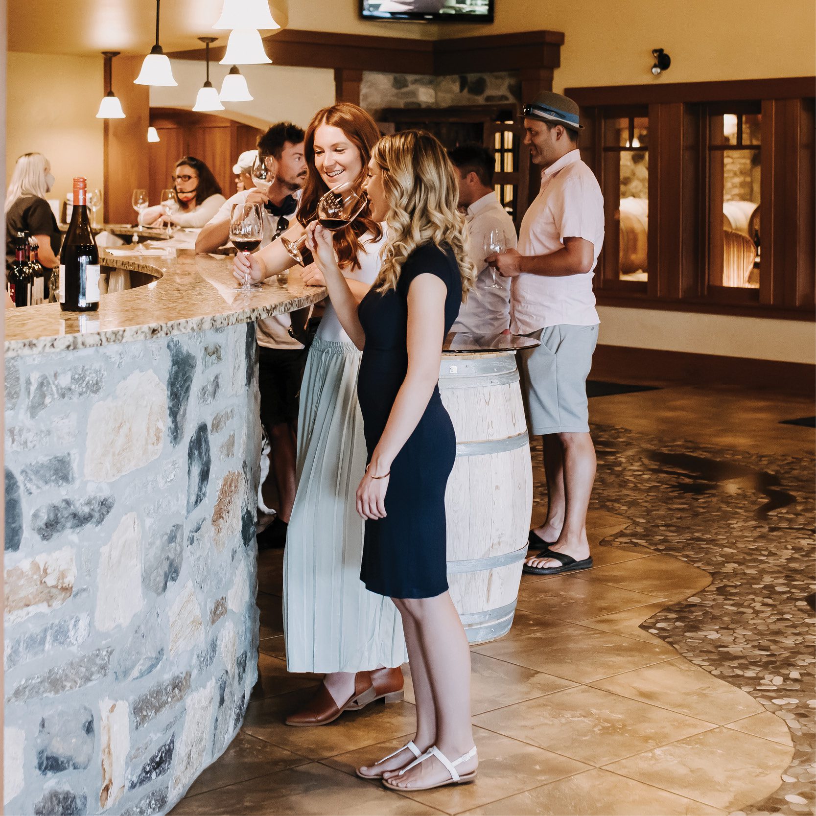 Visit Hester Creek - friends enjoying wine in the tasting room