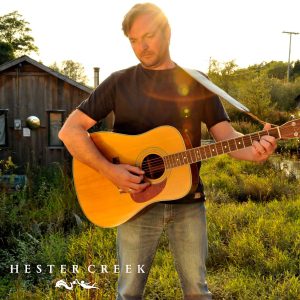 Musician Chris Ronald playing guitar