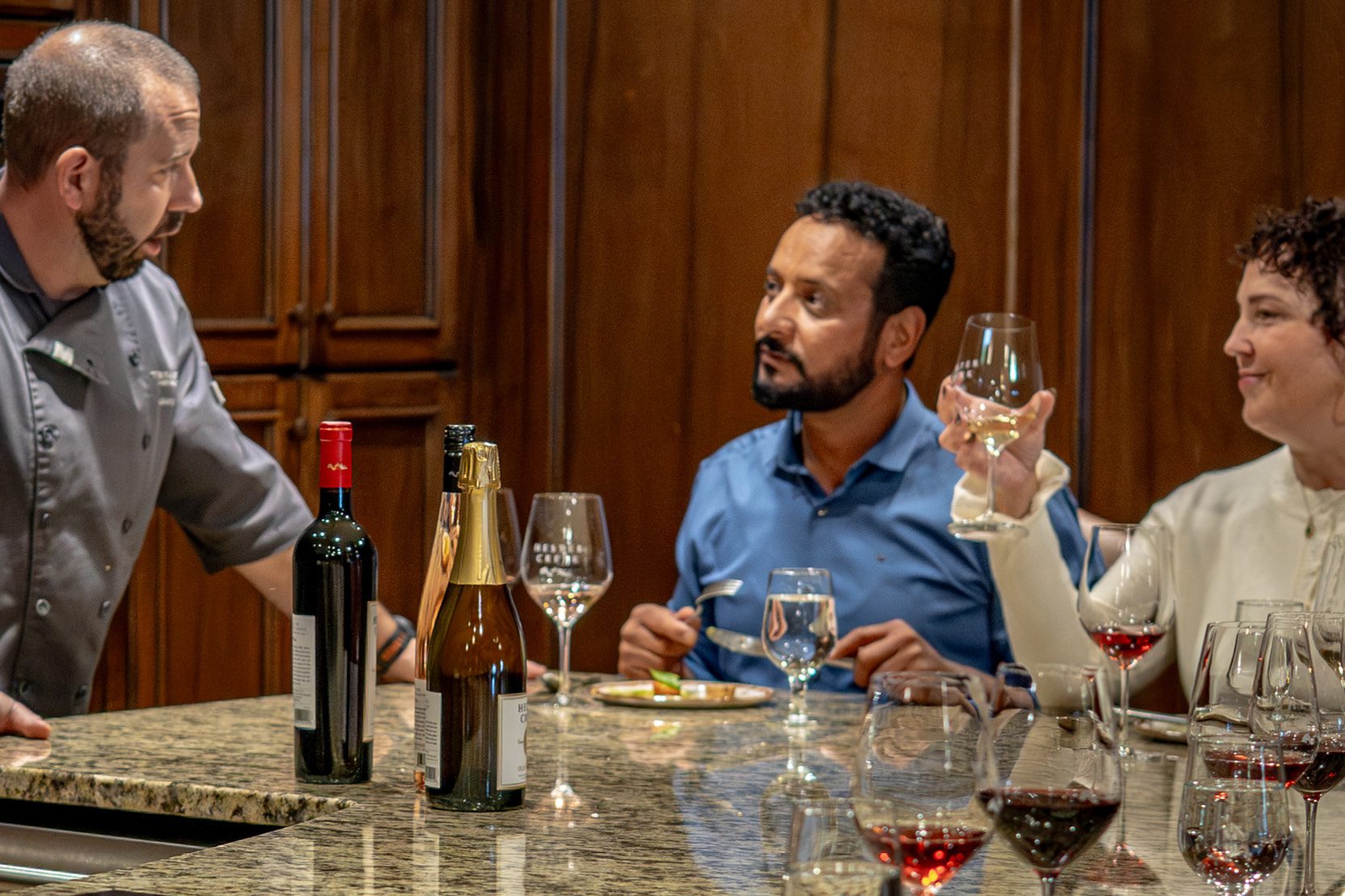 Chef talking to guests at a cooking class
